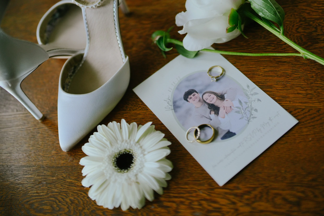Engagement card rings shoes flower at Amy and Teddy's North Dakota farm wedding by Megaset Weddings