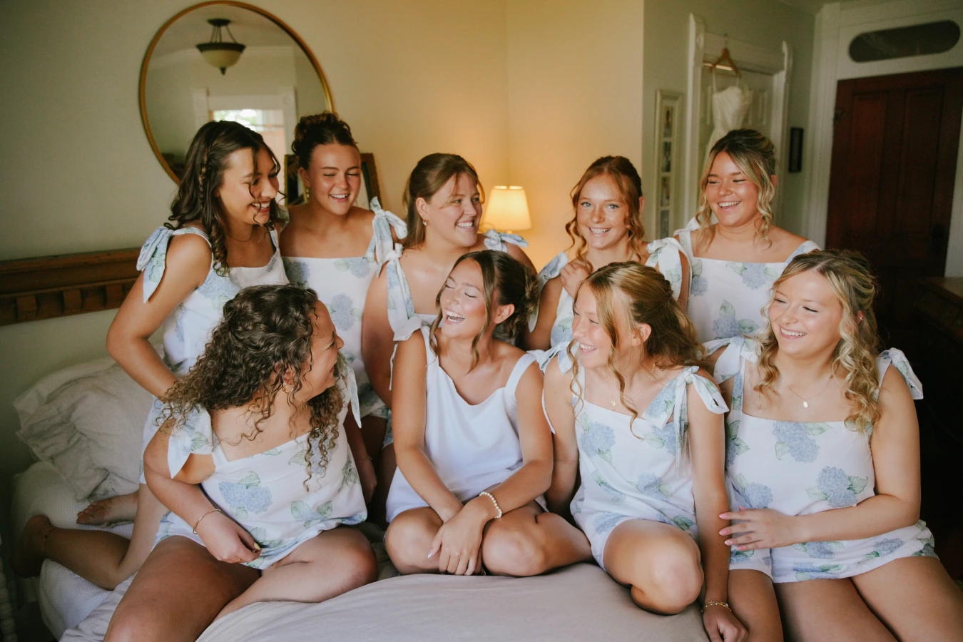 Amysmaids hotel room laughing at Amy and Teddy's North Dakota farm wedding by Megaset Weddings