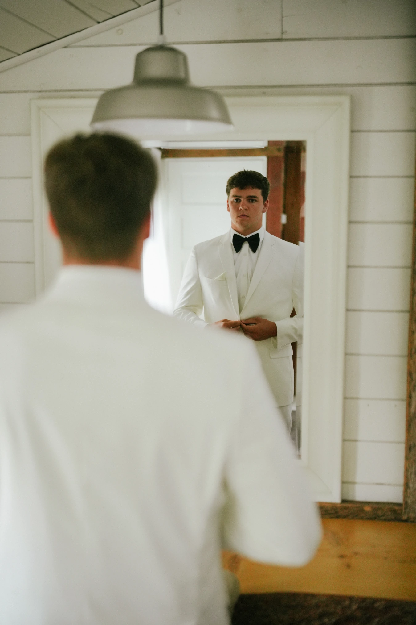 Teddy mirror self view at Amy and Teddy's North Dakota farm wedding by Megaset Weddings