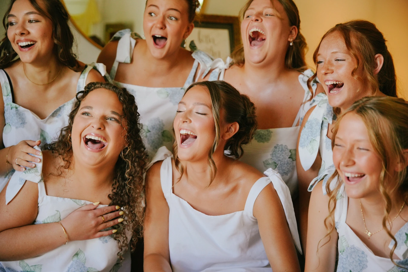 Amysmaids laughing together at Amy and Teddy's North Dakota farm wedding by Megaset Weddings