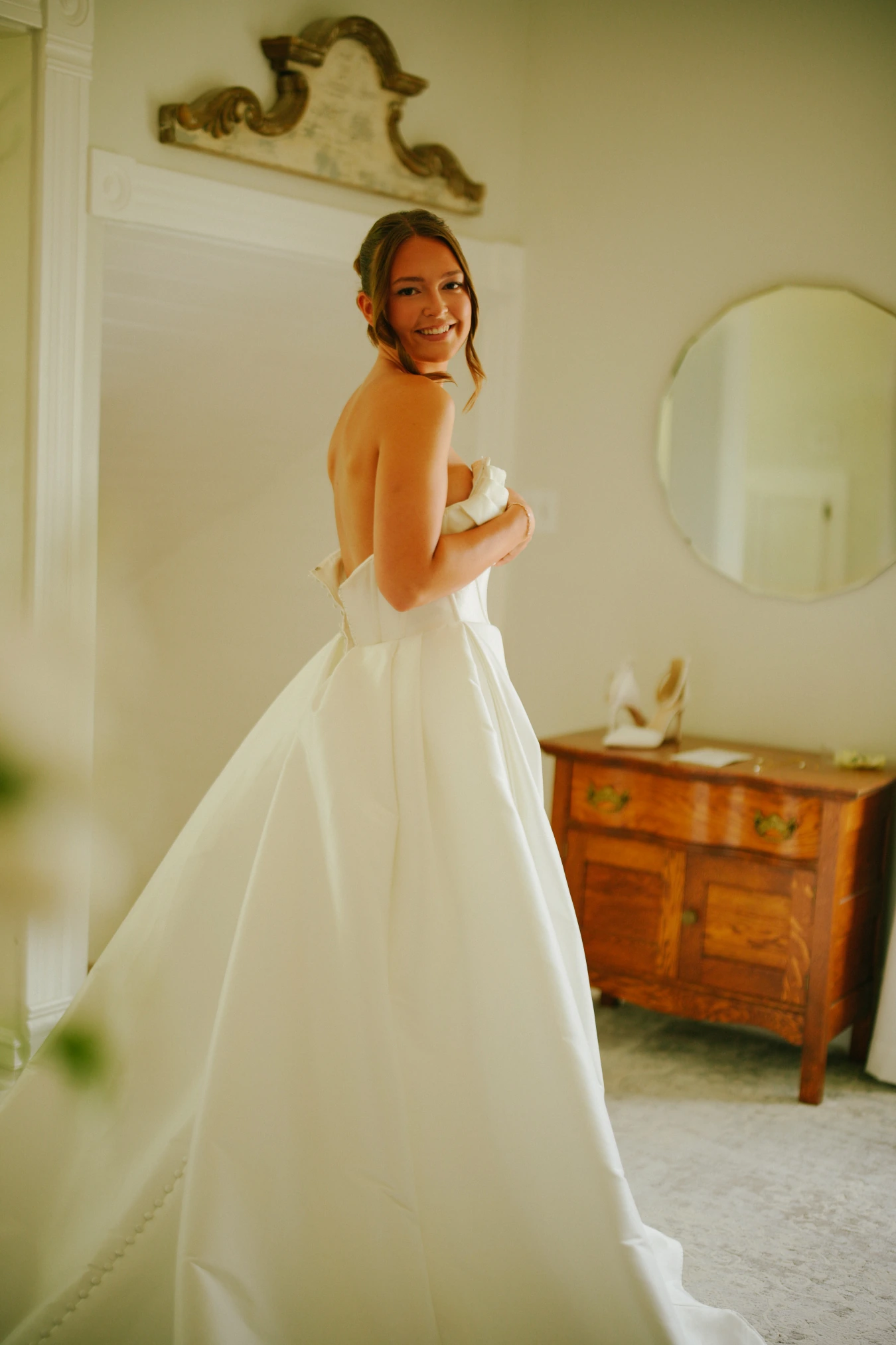 Amy getting ready vintage room at Amy and Teddy's North Dakota farm wedding by Megaset Weddings
