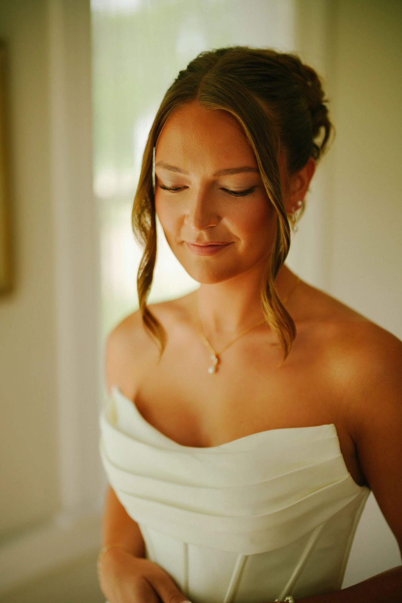 Amy strapless dress updo indoor portrait at Amy and Teddy's North Dakota farm wedding by Megaset Weddings