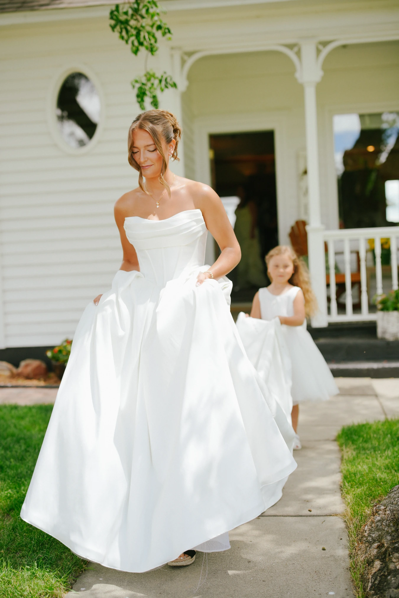 Amy walking path young girl at Amy and Teddy's North Dakota farm wedding by Megaset Weddings