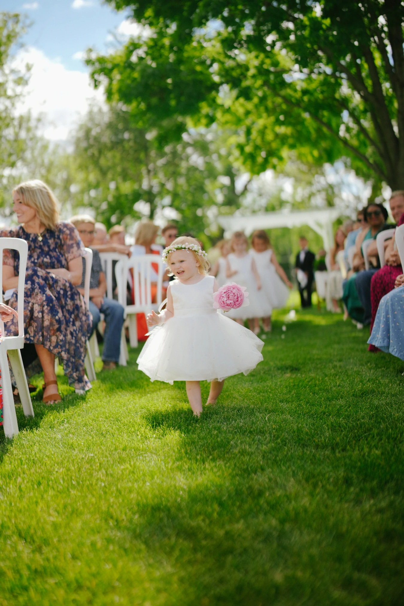 Flower girl aisle at Amy and Teddy's North Dakota farm wedding by Megaset Weddings
