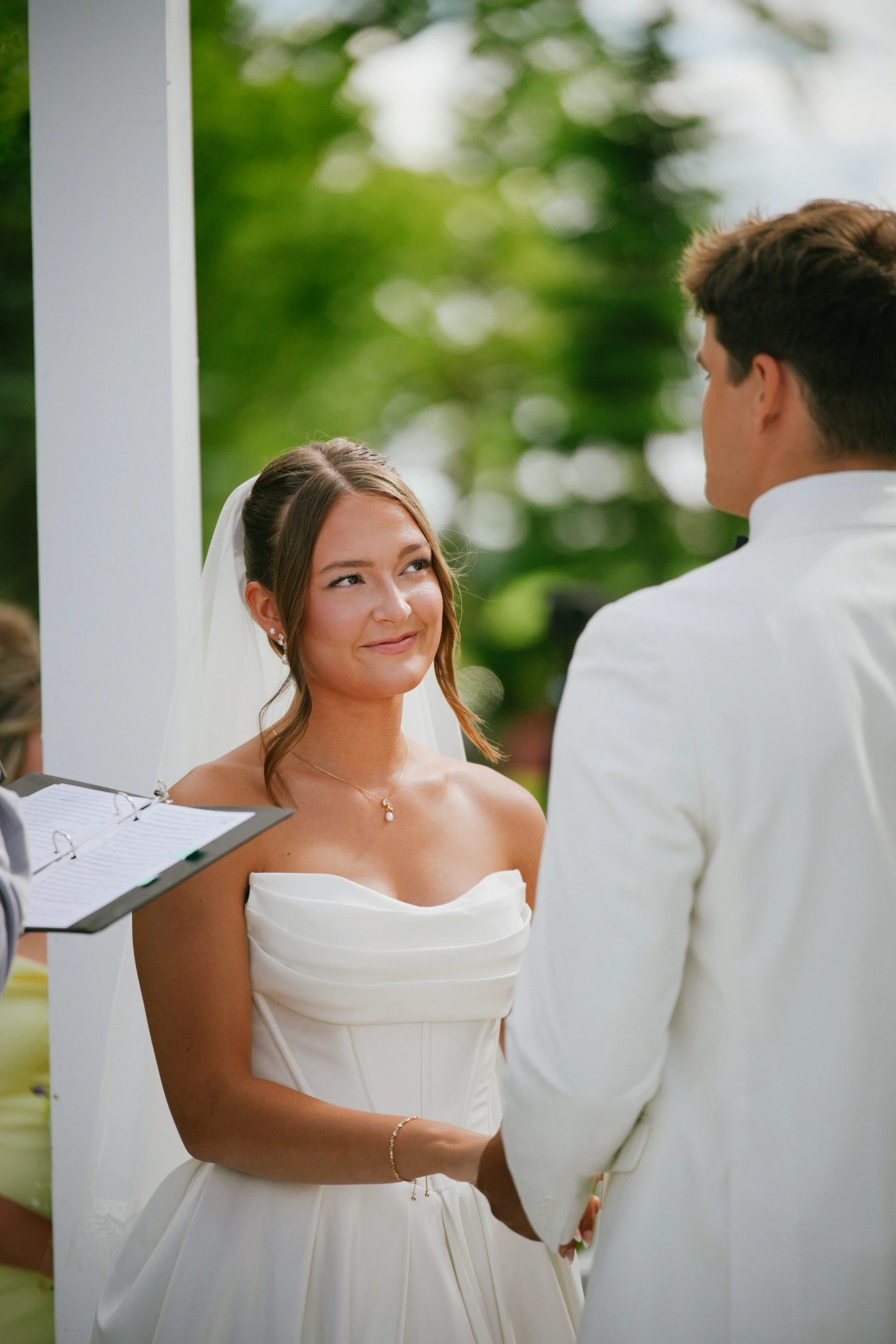 Amy and teddy ceremony outdoors at Amy and Teddy's North Dakota farm wedding by Megaset Weddings