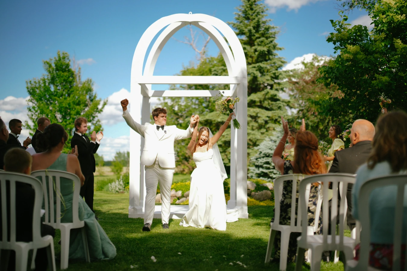 Amy and teddy arch dance outdoor at Amy and Teddy's North Dakota farm wedding by Megaset Weddings