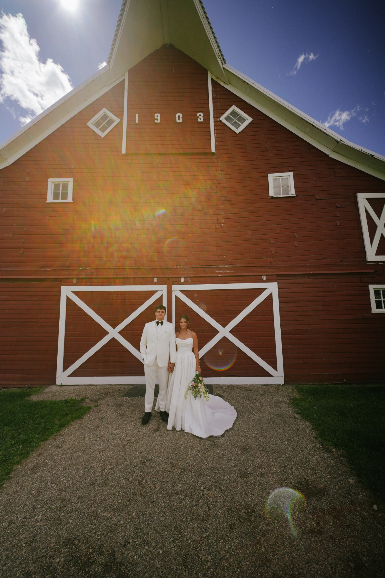 Amy and teddy barn sunlight at Amy and Teddy's North Dakota farm wedding by Megaset Weddings