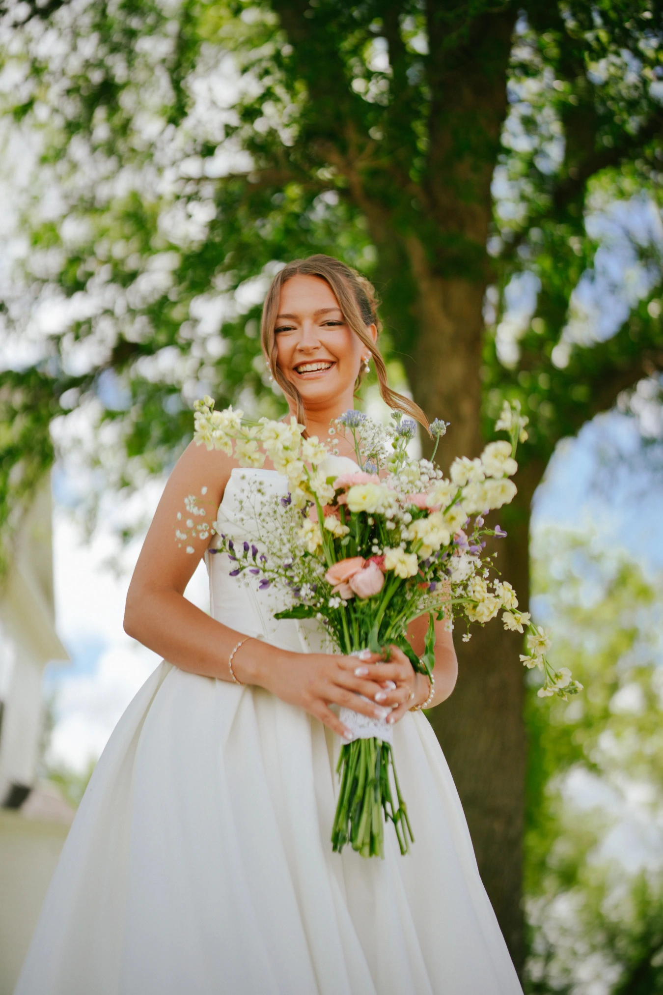 Amy bouquet nature at Amy and Teddy's North Dakota farm wedding by Megaset Weddings