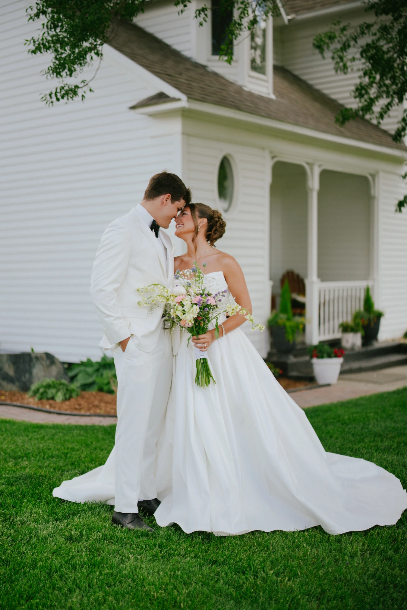 Amy and teddy kiss romantic at Amy and Teddy's North Dakota farm wedding by Megaset Weddings