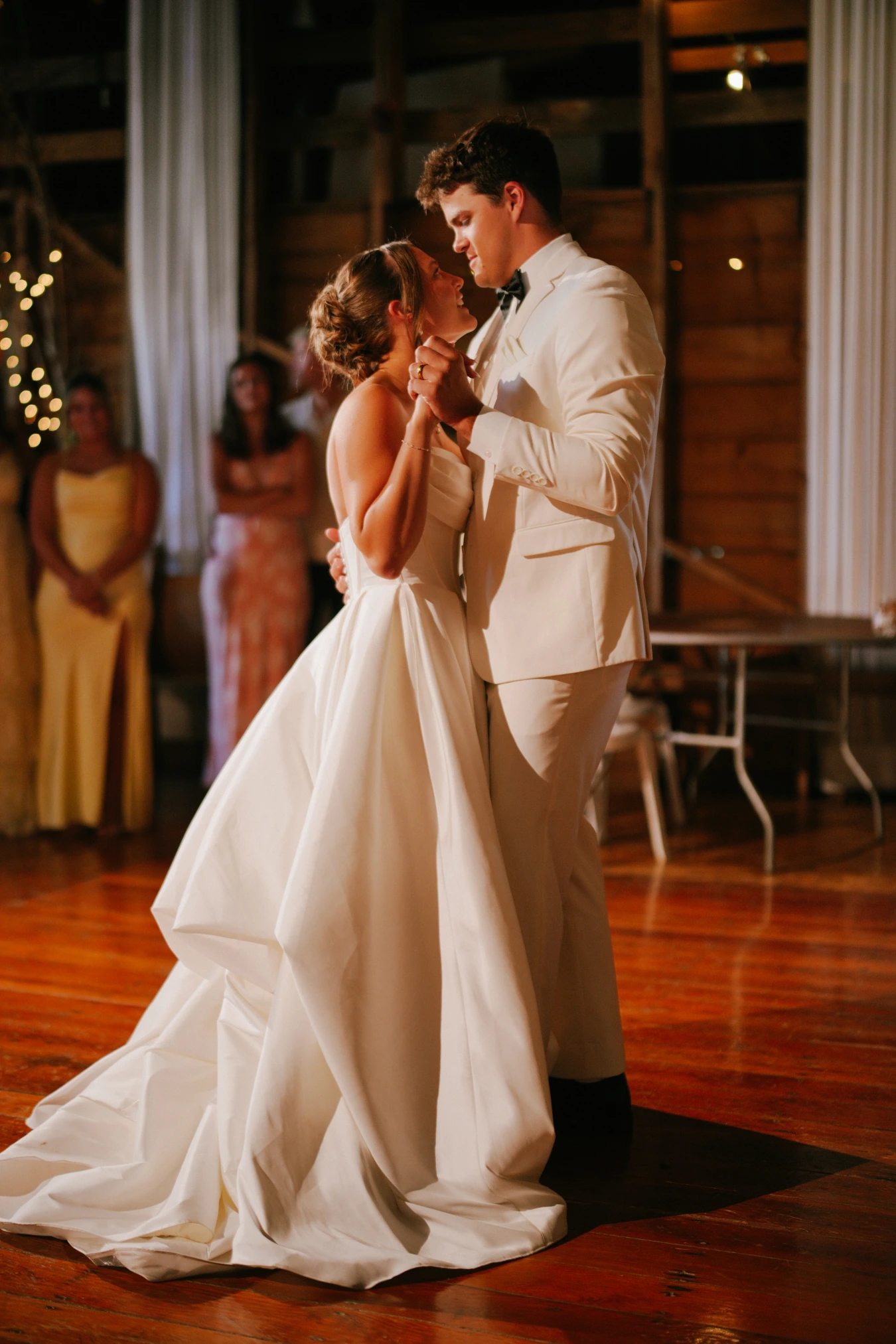 Reception dancing couple at Amy and Teddy's North Dakota farm wedding by Megaset Weddings