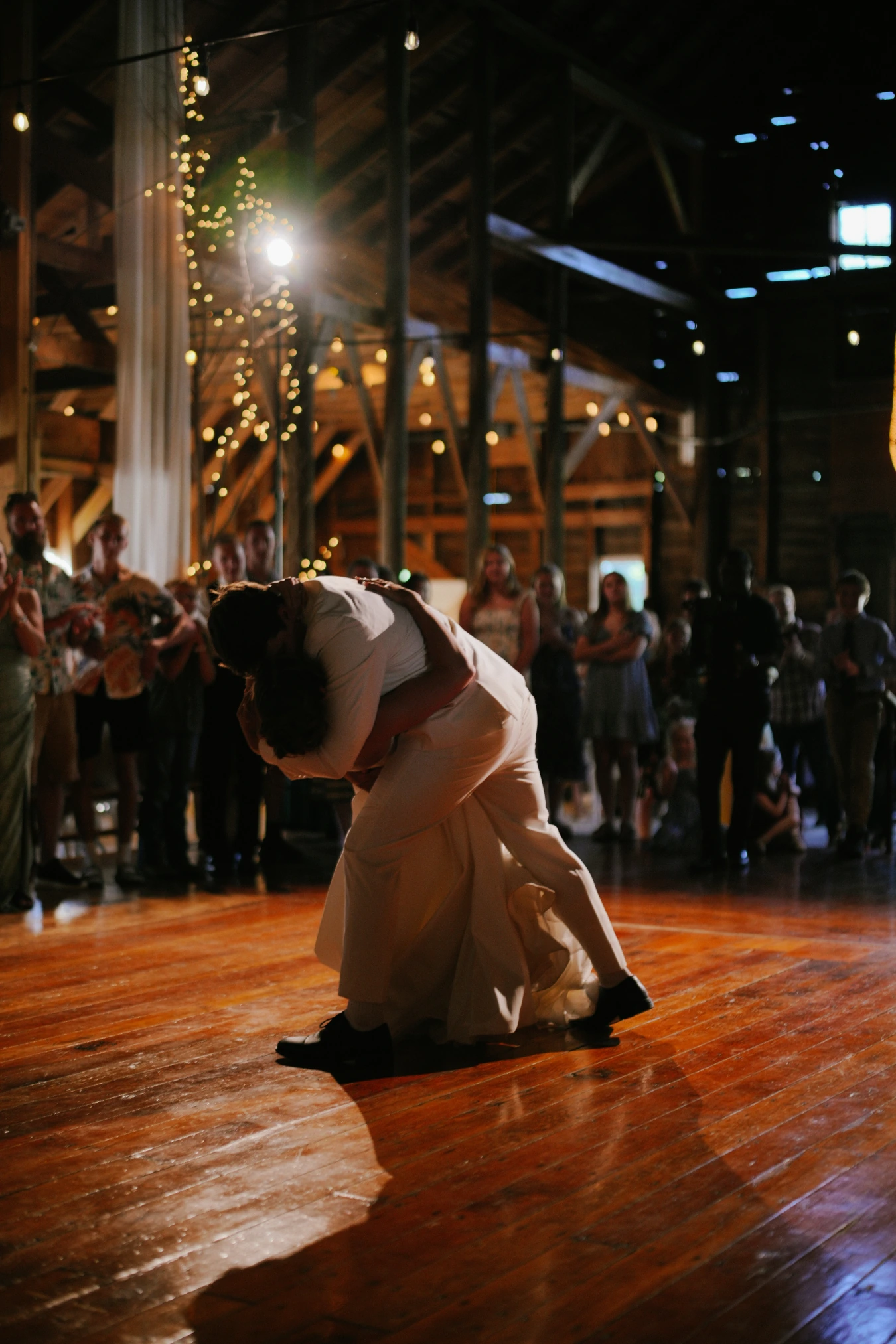 Reception dancing wooden floor at Amy and Teddy's North Dakota farm wedding by Megaset Weddings