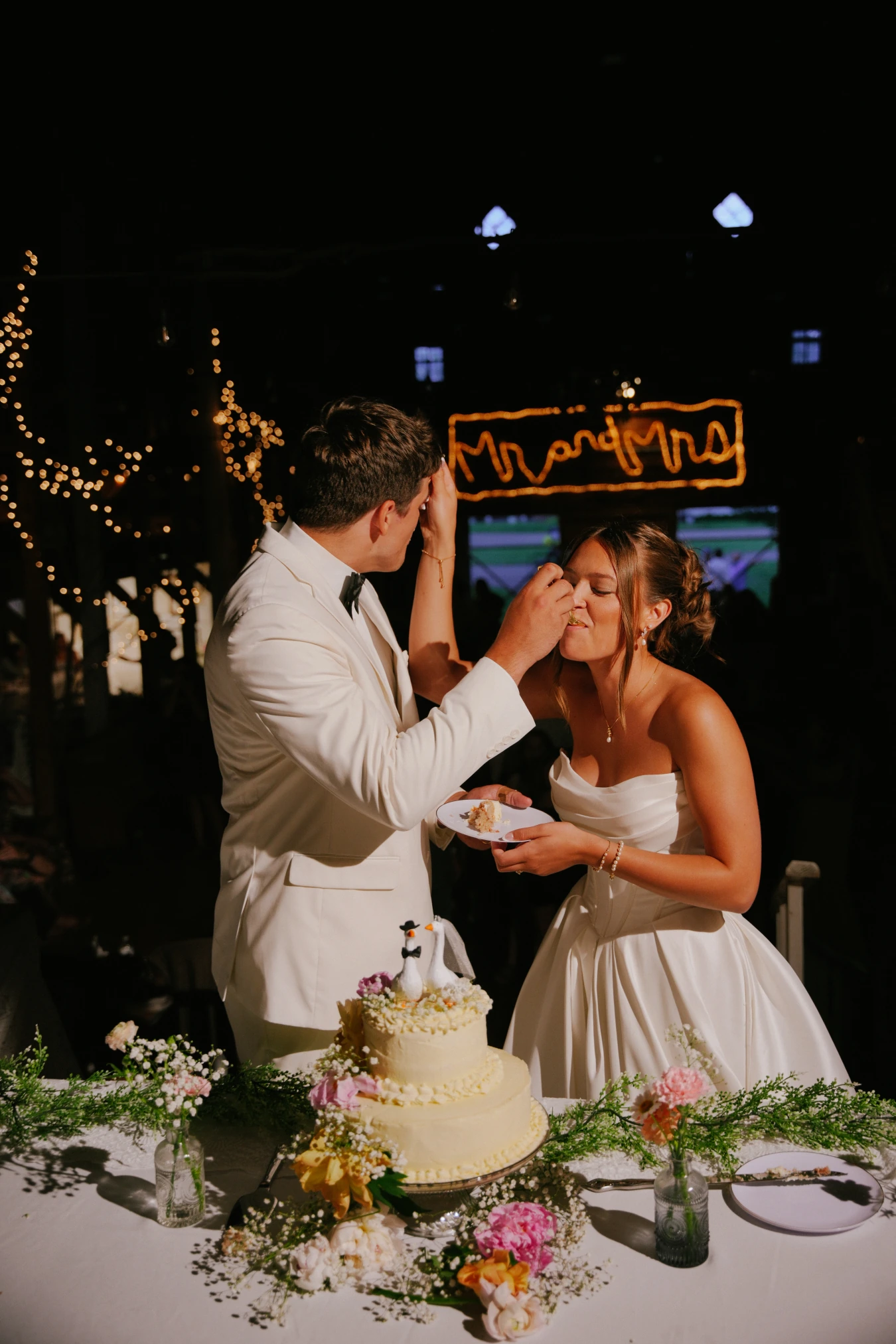 Reception feed cake at Amy and Teddy's North Dakota farm wedding by Megaset Weddings