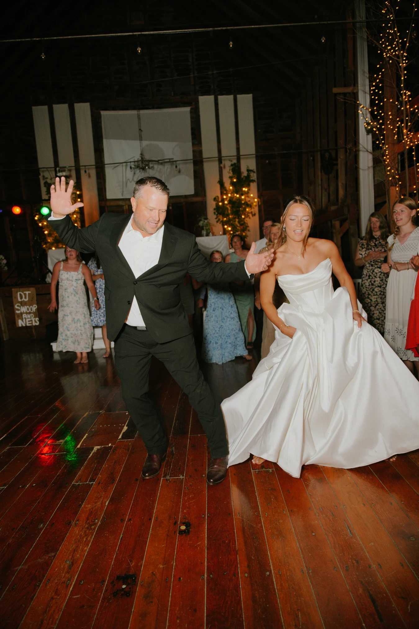 Amy and teddy reception dancing at Amy and Teddy's North Dakota farm wedding by Megaset Weddings