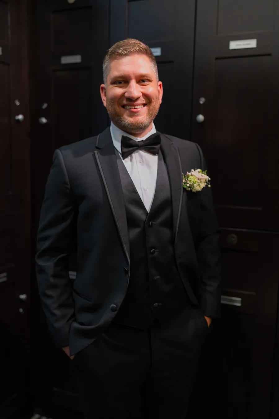 Kevin in his black tuxedo before the wedding at The Club at Quail Ridge