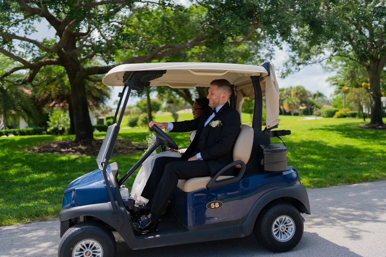 Kevin sitting in a golf cart at The Club at Quail Ridge