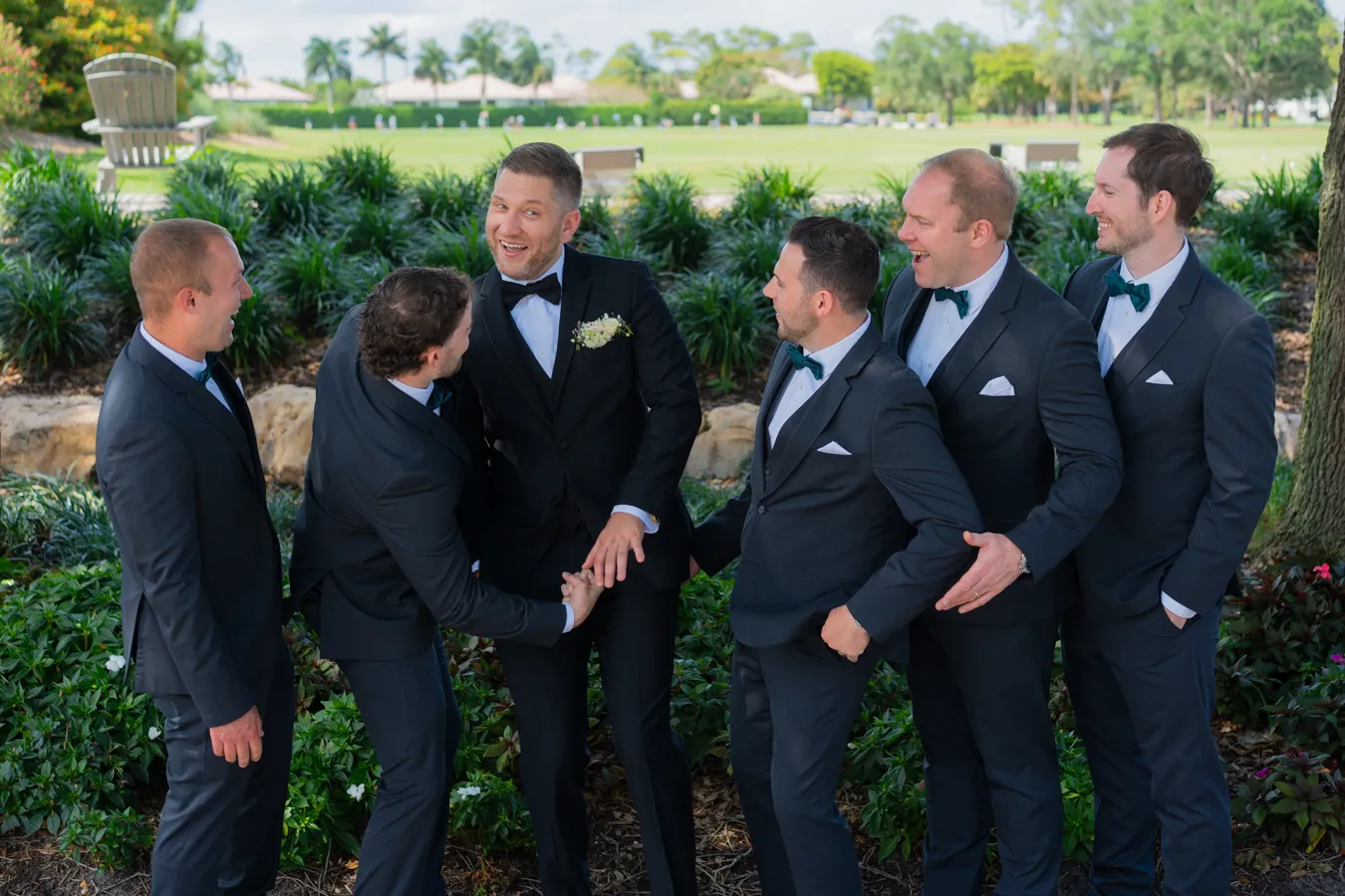 Kevin and groomsmen laughing together before the ceremony