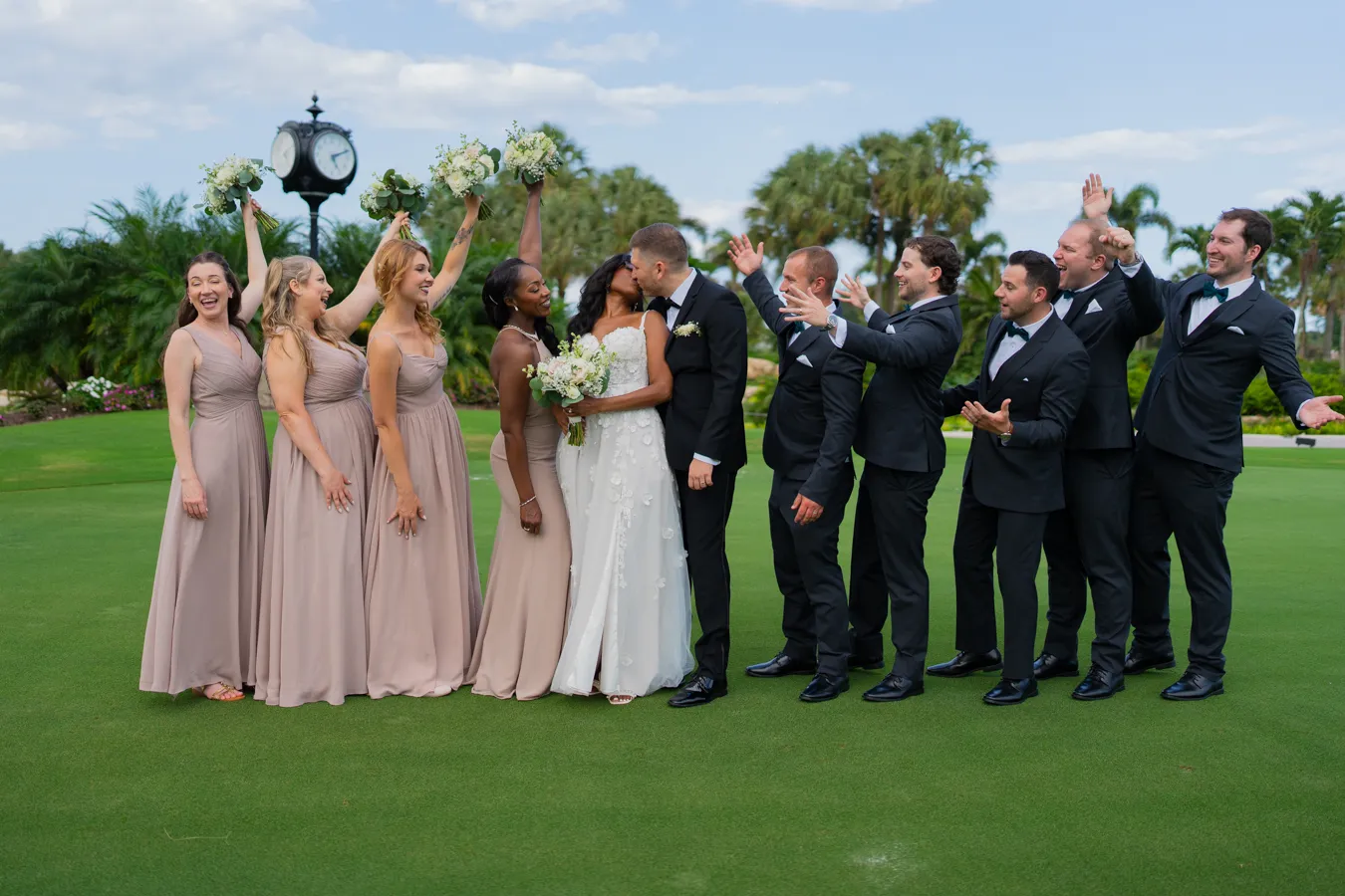 Wedding party cheering for Belinda and Kevin on the lawn