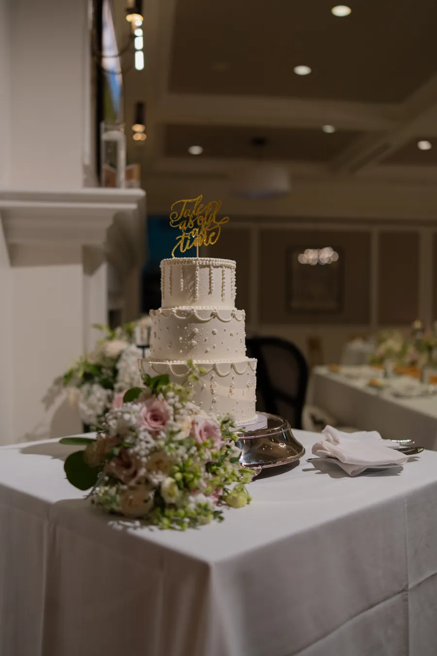 Elegant wedding cake in the reception ballroom