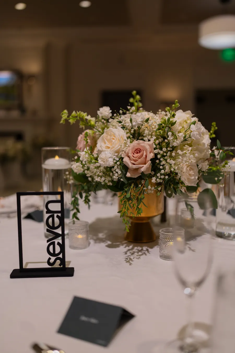 Reception table flowers and menu detail at The Club at Quail Ridge