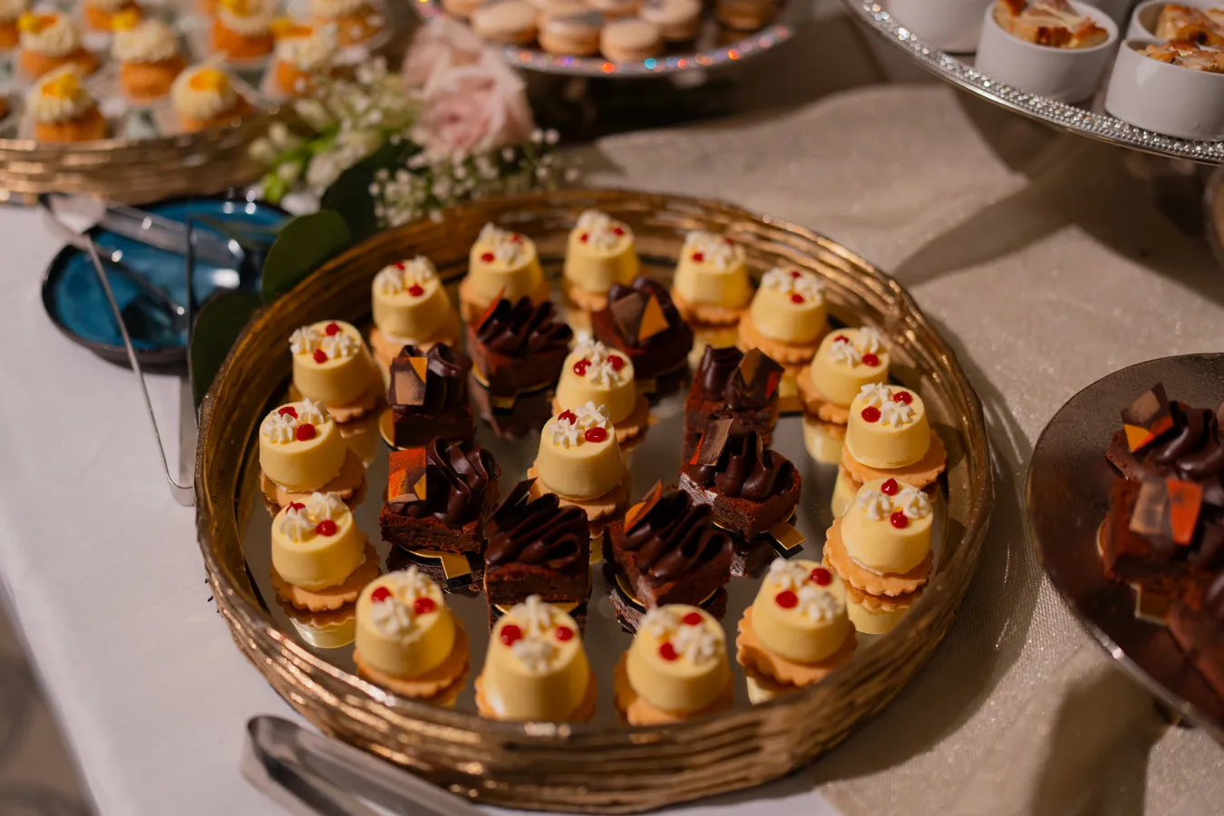 Dessert display with mini pastries at the wedding reception