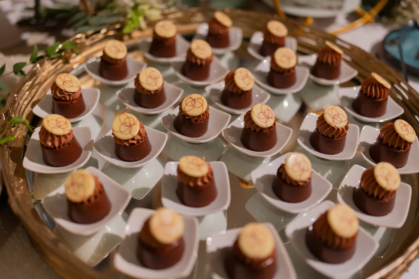 Chocolate dessert bites displayed for wedding guests