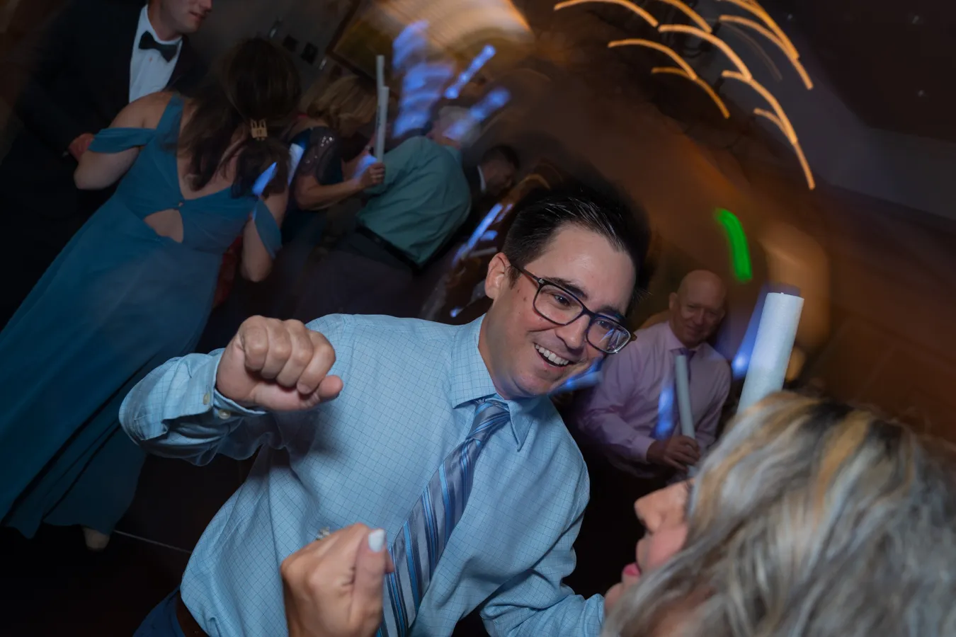 Wedding guest dancing during the reception celebration