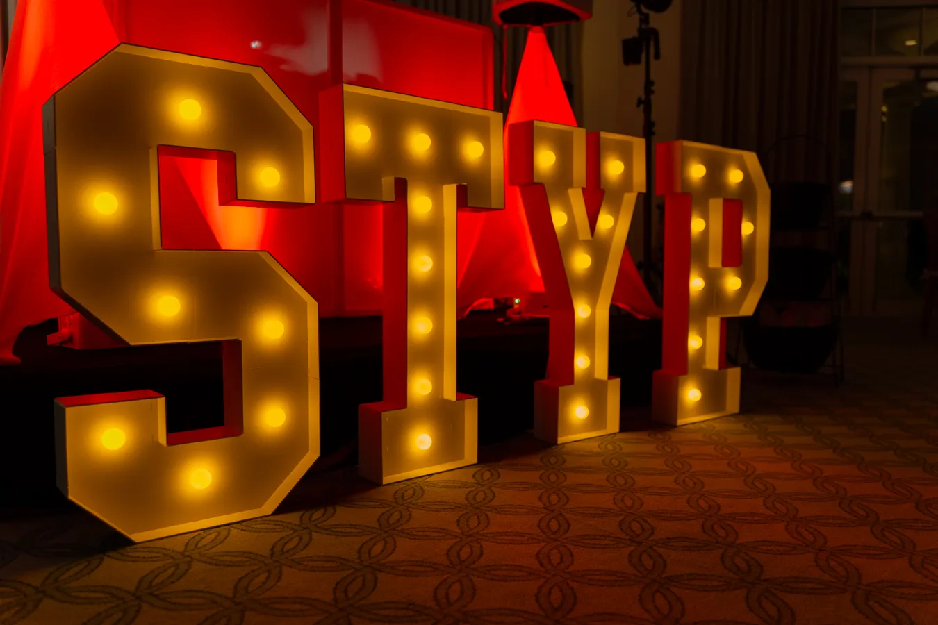 Light up stay sign at the wedding reception